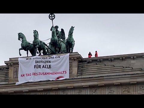 Climate Activists Protest on Berlin’s Brandenburg Gate