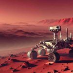 Generate a realistic, high-resolution image of a space exploration rover, bathed in the subtle red-orange hues of an alien landscape. The terrain around the rover is a semi-arid, rocky desert with dust particles seemingly suspended in the thin atmosphere. In the never-ending crimson horizons, barren mountains should dot the landscape, giving a sense of vast expanse. The rover itself is a mix of white and metallic hues, with its intricate mechanical parts clearly displayed. It casts a small shadow on the dusty ground as the faint Martian sunlight shines on it.